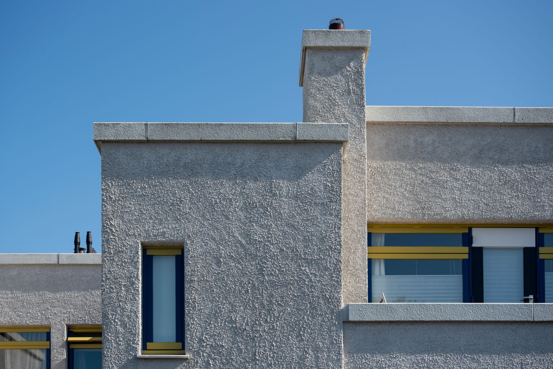 Modern concrete facade against blue sky