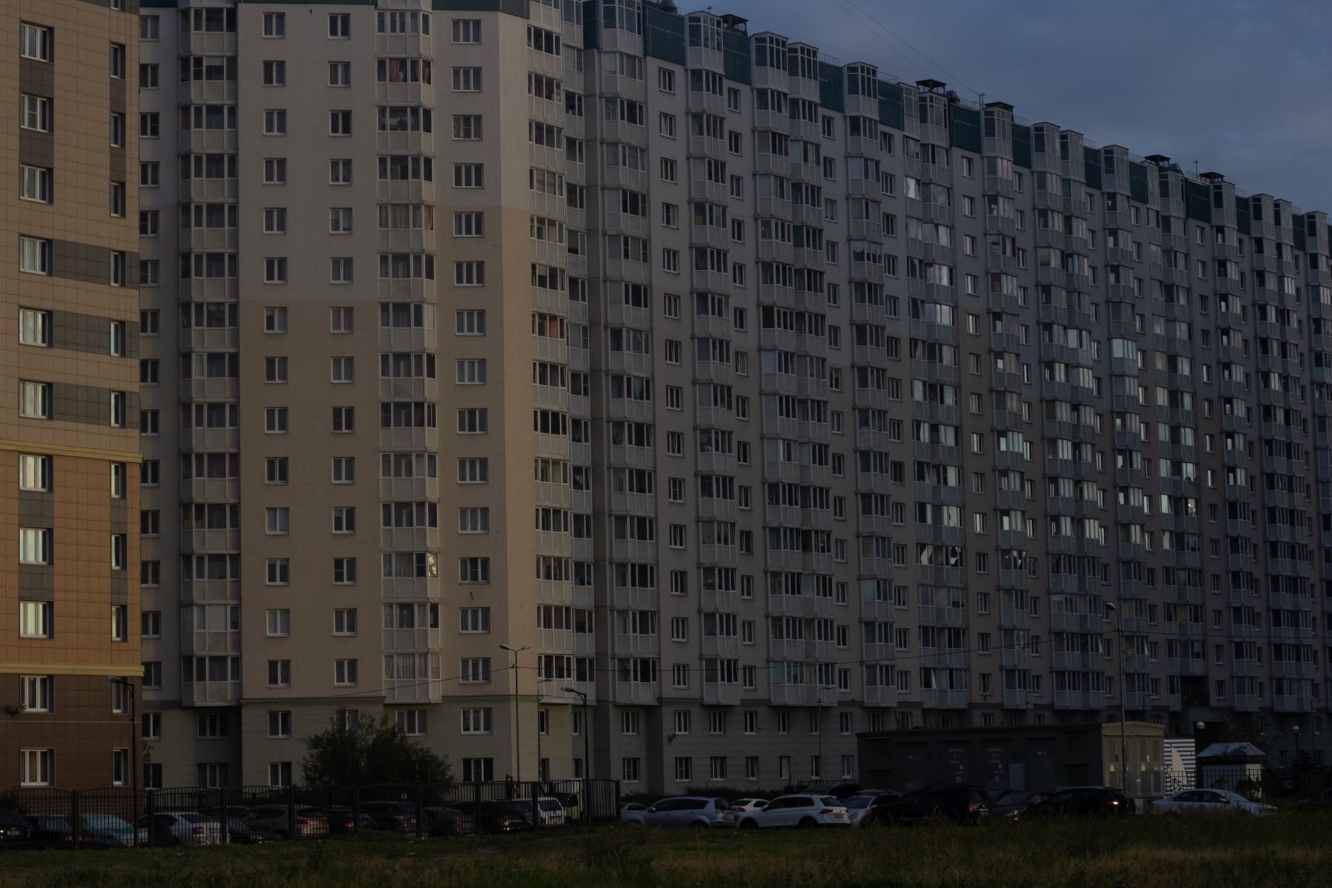 Tall residential facade at dusk